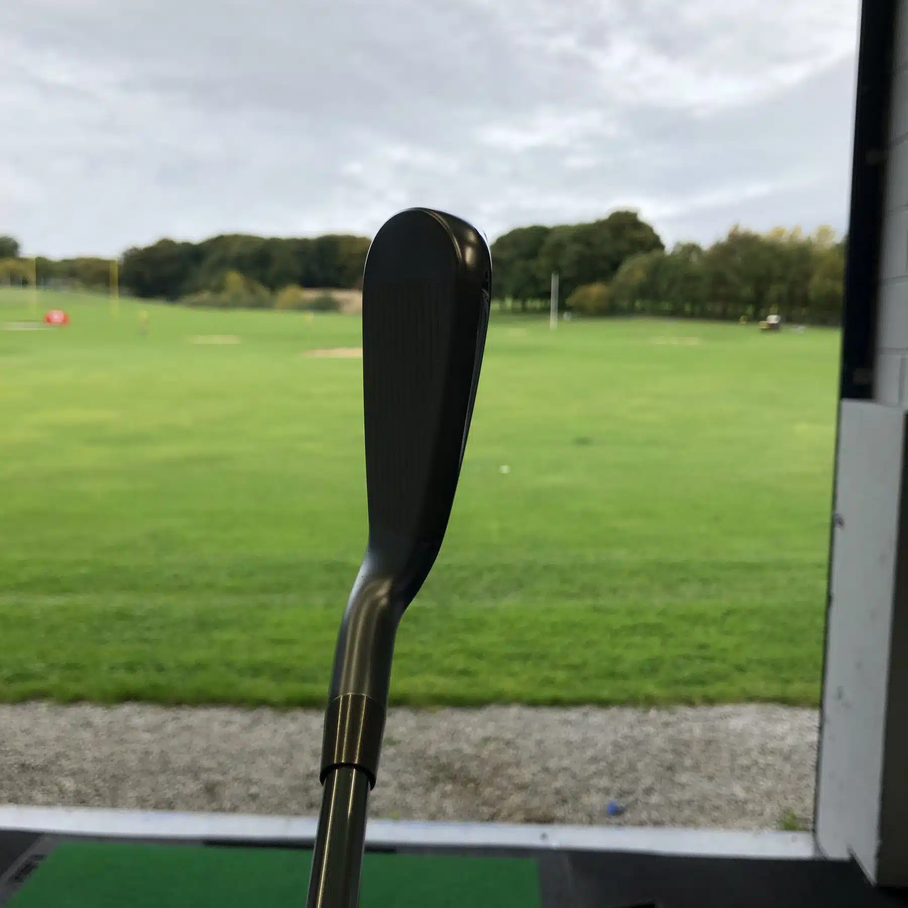 Fitting a wedge on the outdoor range at Express Golf